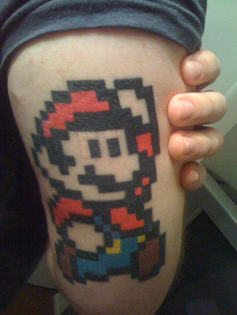 Mario on back of arm. An awesome mario tattoo 